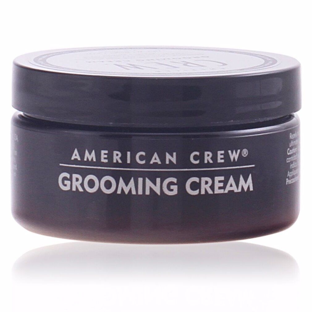 Schwarze Dose American Crew Grooming Cream. Weißer Text auf dem Behälter. Deckel mit Logo.