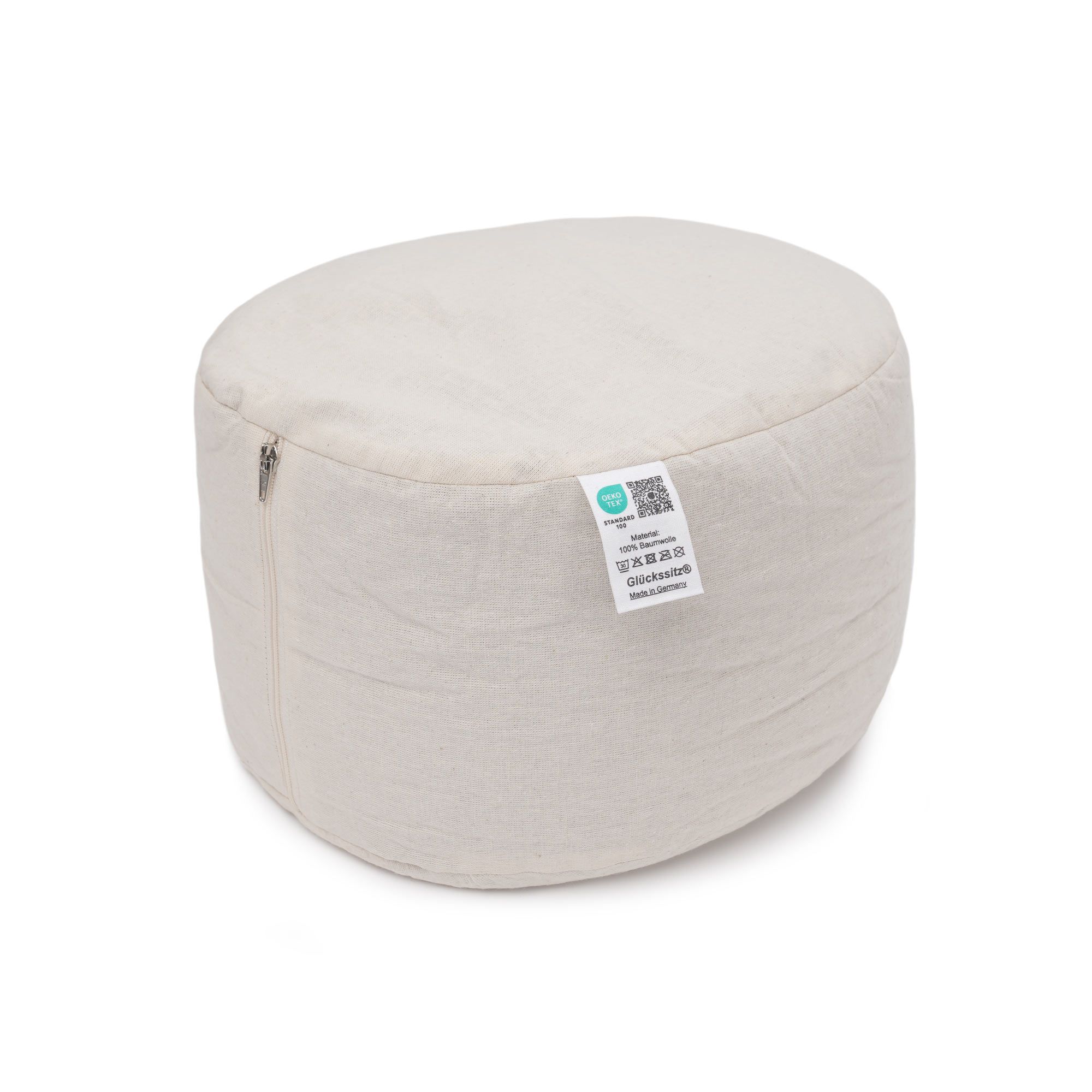 Ovales Yogakissen aus Naturstoff mit Etikett und Reißverschluss.