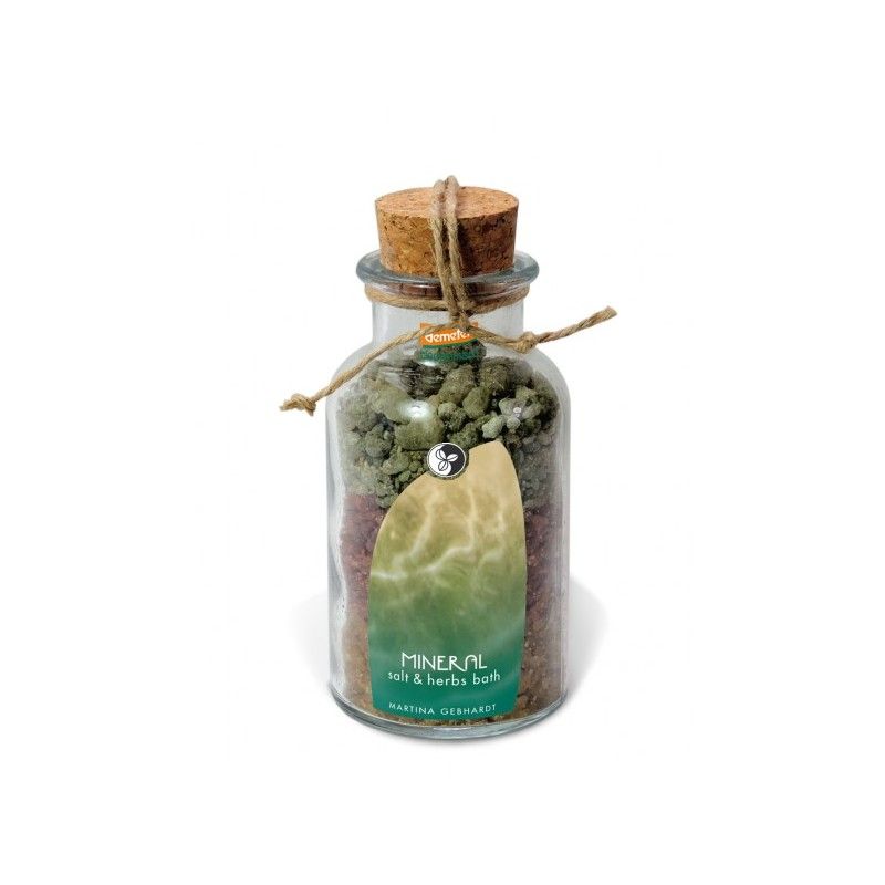 Glasflasche mit Korken und Schnur. Enthält farbige Salze und Kräuter. Etikett mit Produktnamen und Marke.