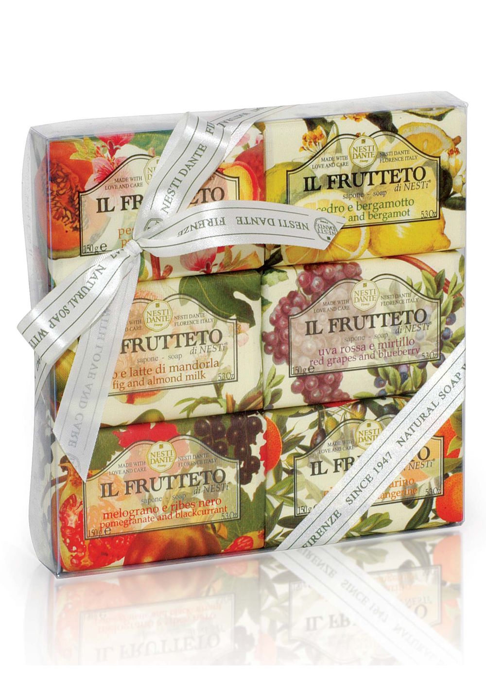 Nesti Dante Il Frutteto Geschenkset: Sechs Seifen mit Frucht- und Zitrusmotiven, gebunden mit einem Band.