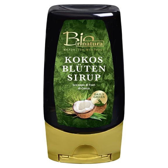 Schwarze Flasche mit goldenem Deckel. Aufschrift: Kokos Blüten Sirup. Abbildung einer Kokosnuss.