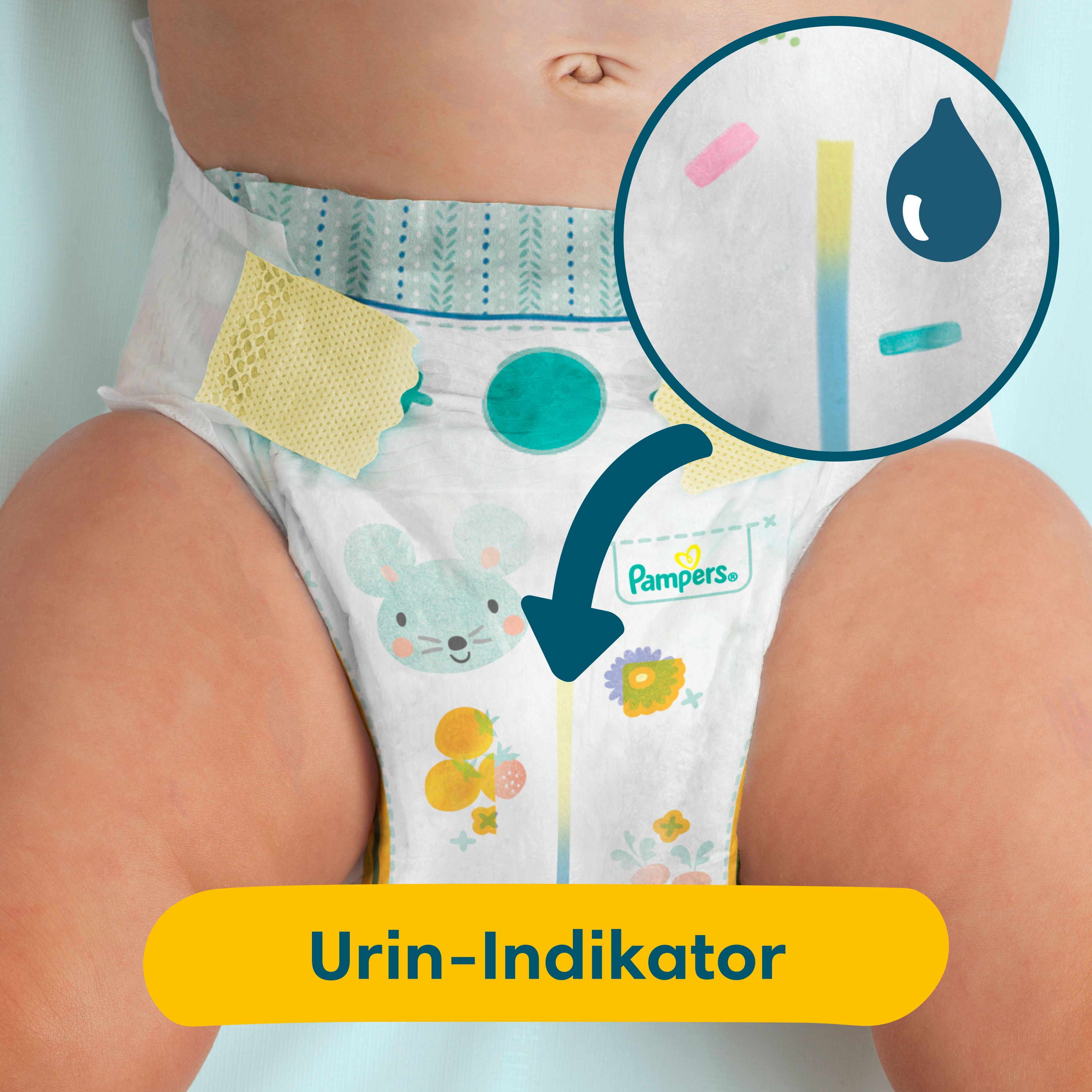 Nahaufnahme einer Windel mit Urin-Indikator. Pfeil zeigt auf den Indikator. Text: Urin-Indikator.