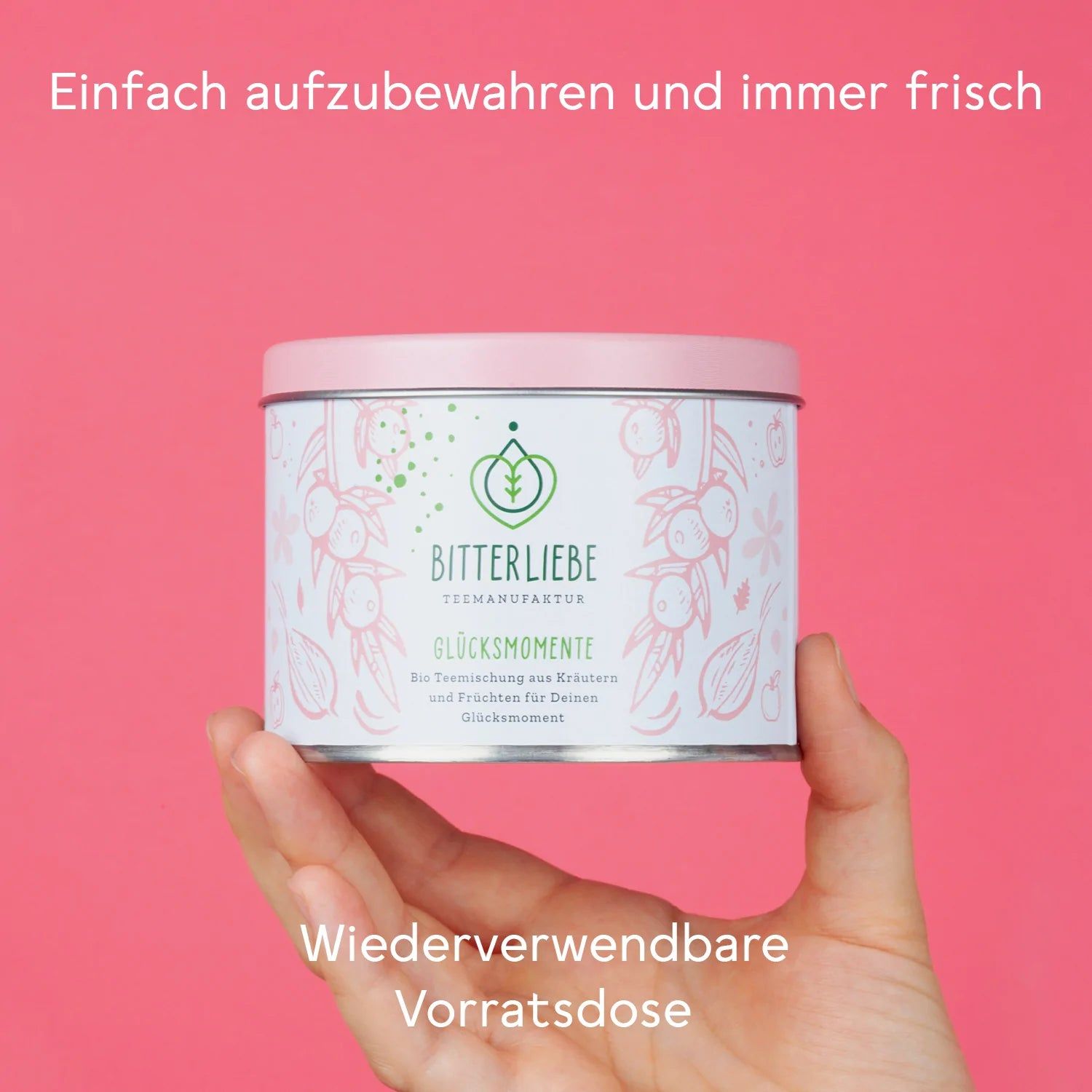 Hand hält eine runde Dose mit Deckel. Aufschrift: BitterLiebe Teemanufaktur - Glücksmomente. Text: Wiederverwendbare Vorratsdose.