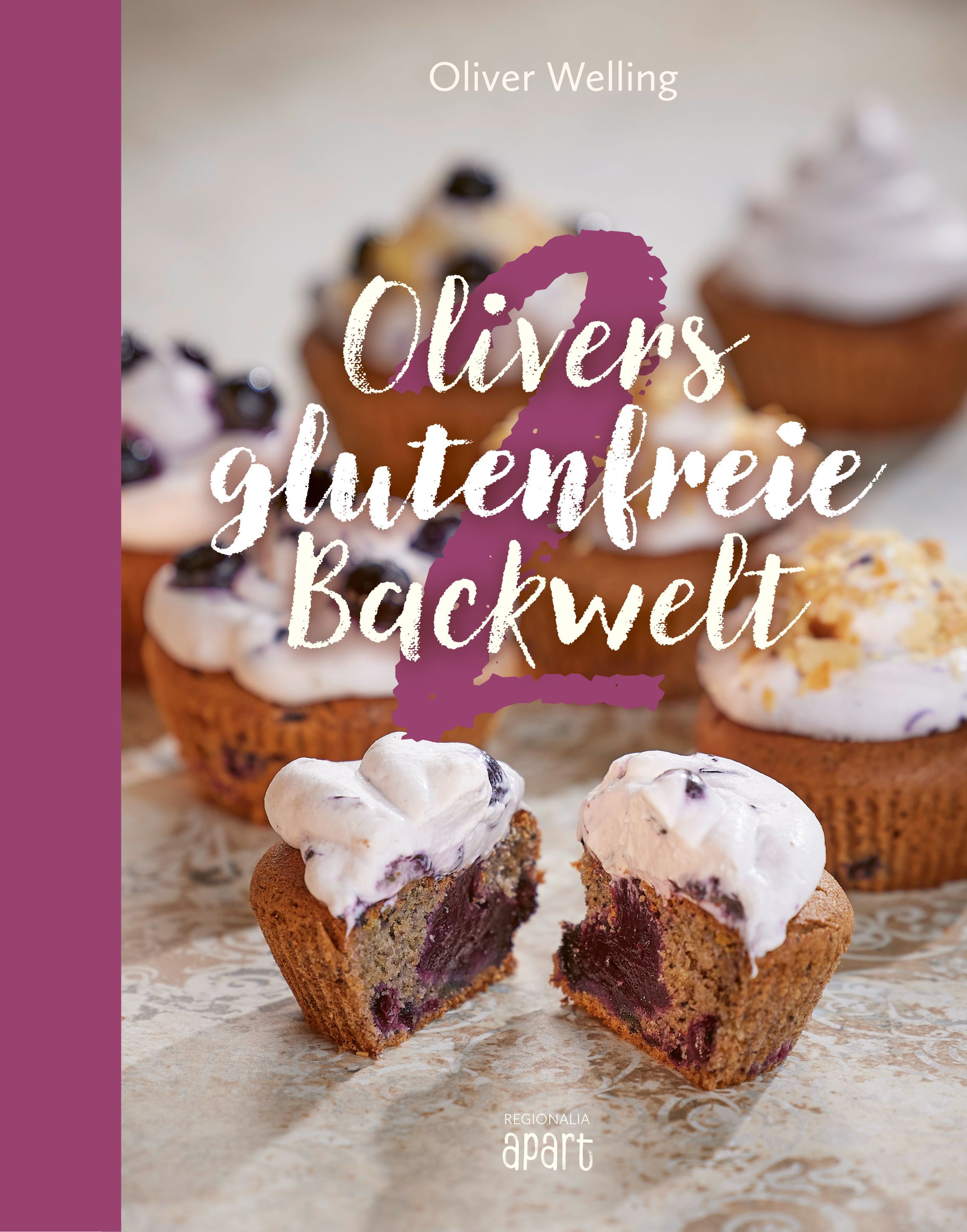 Buchcover mit dem Titel "Olivers glutenfreie Backwelt Band 2". Gezeigt werden Cupcakes mit Creme und Blaubeeren.