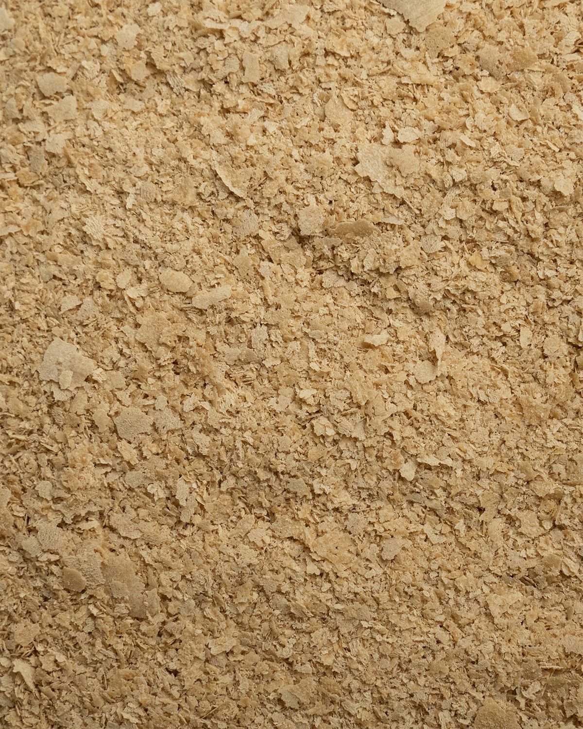 Close-up of buXtrade Hefeflocken showing their flaky texture.