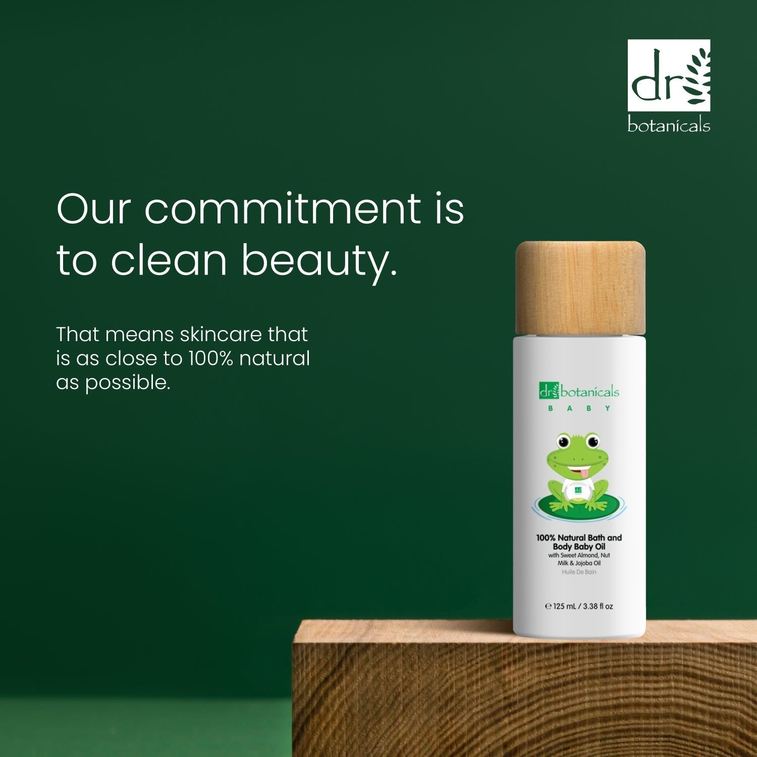 Flasche auf Holzblock. Text: Our commitment is to clean beauty. That means skincare that is as close to 100% natural as possible.