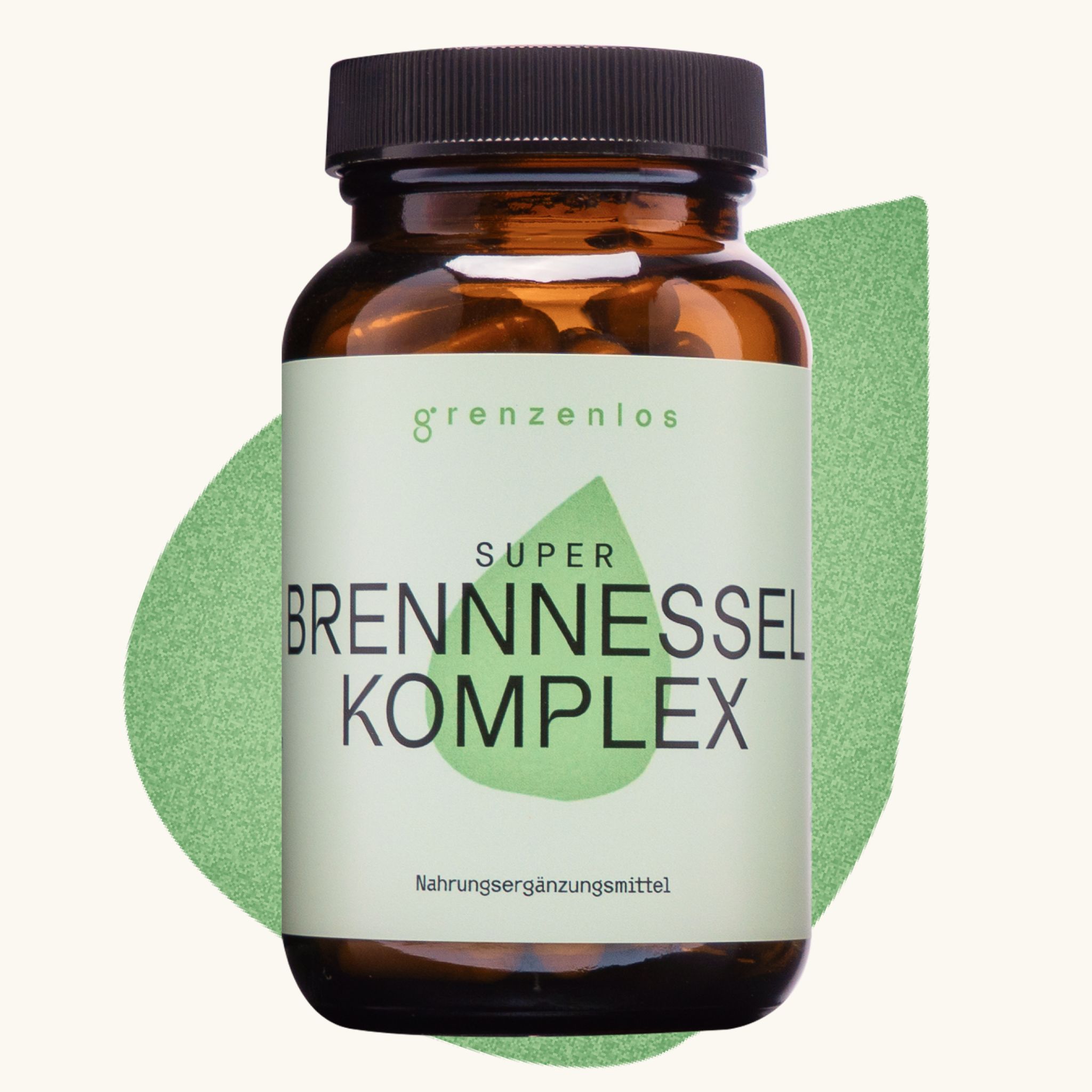 Braune Glasflasche mit grünem Etikett: "grenzenlos SUPER BRENNNESSEL KOMPLEX" auf einem grünen Blattmotiv.