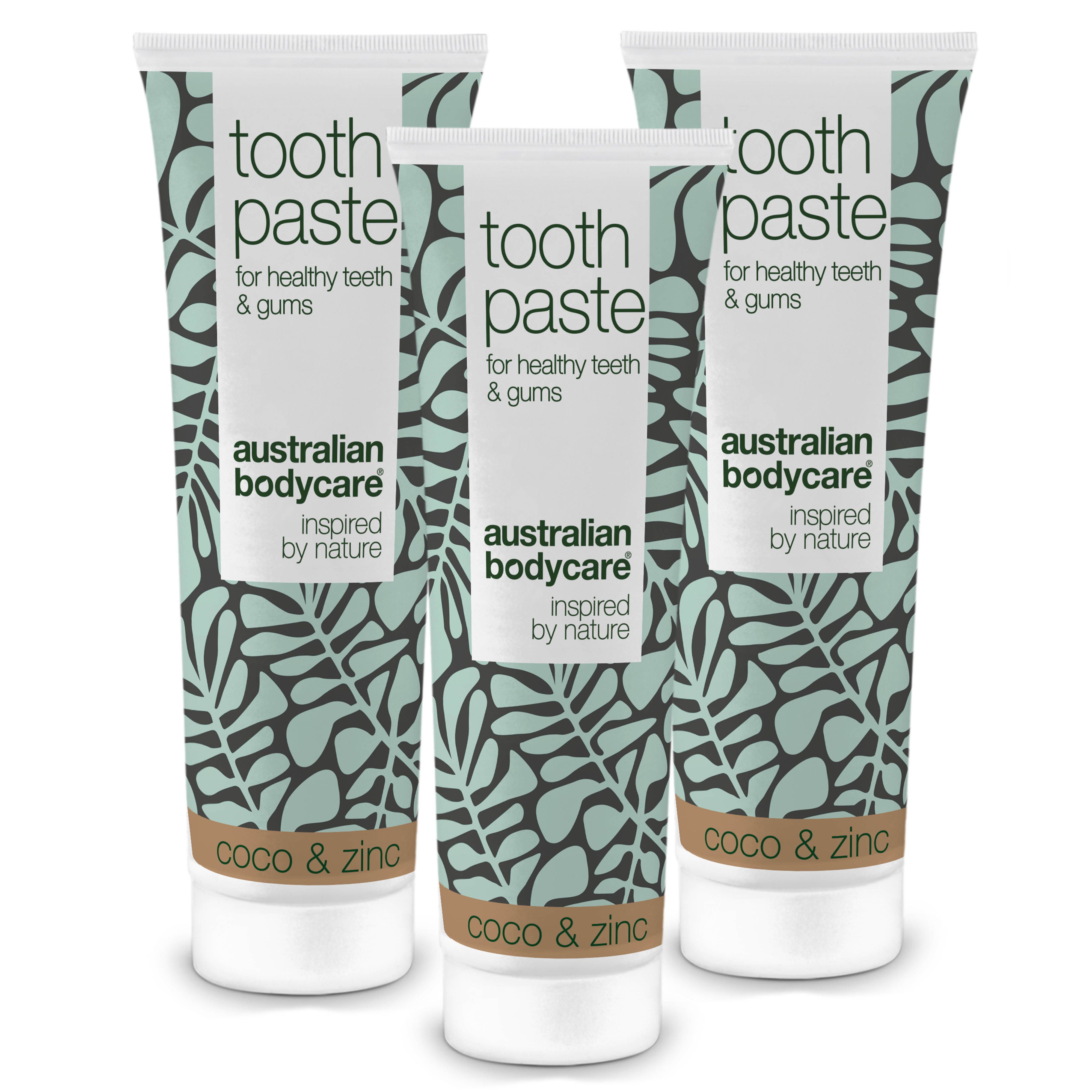 Drei Tuben Zahnpasta. Weiß-türkises Design mit Blättern. Aufschrift: Australian Bodycare, Coco & Zinc.