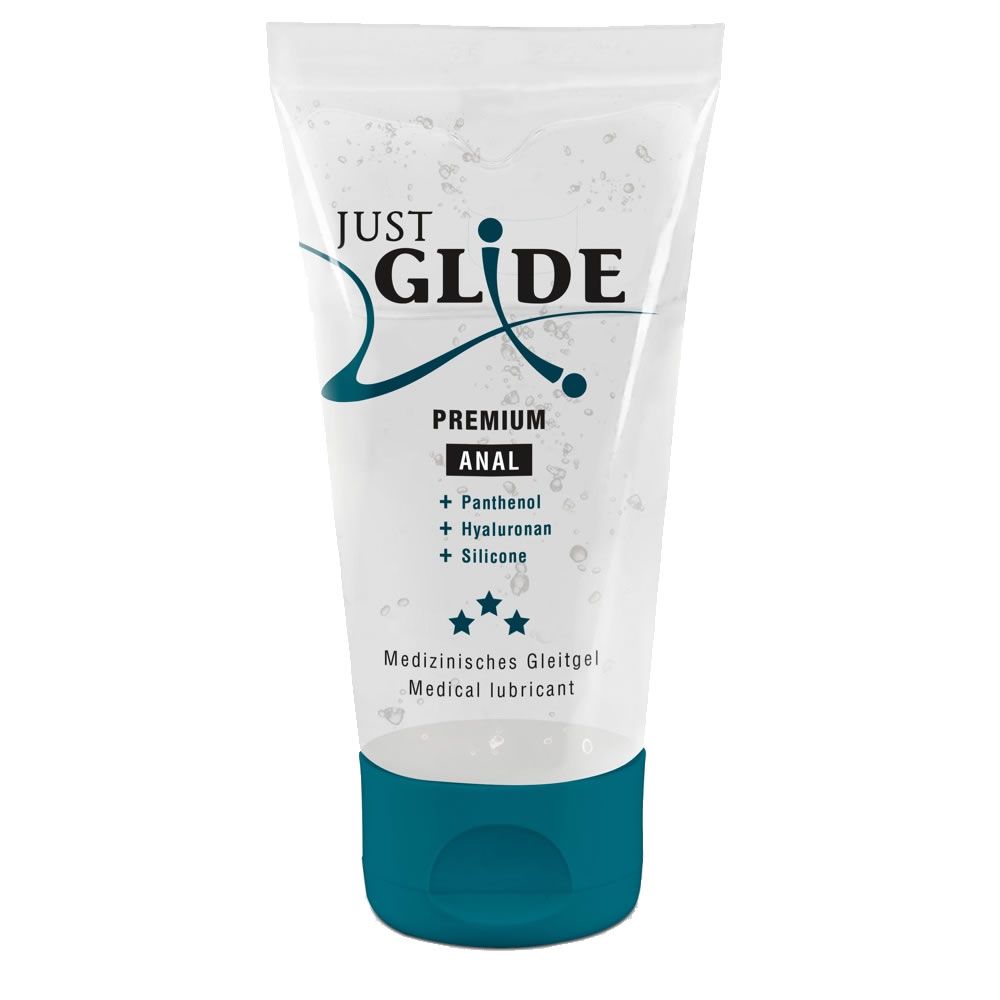 Transparente Tube mit blauem Verschluss. Aufschrift: "JUST GLIDE PREMIUM ANAL". Sterne und Inhaltsstoffe.