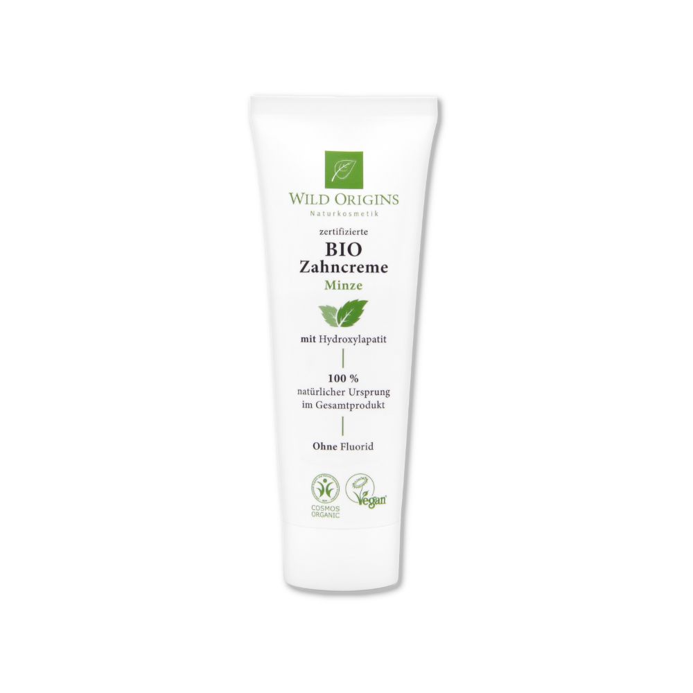 Weiße Tube mit grünen Logos und Schriftzug. "Bio Zahncreme Minze" und "Ohne Fluorid" sind lesbar.