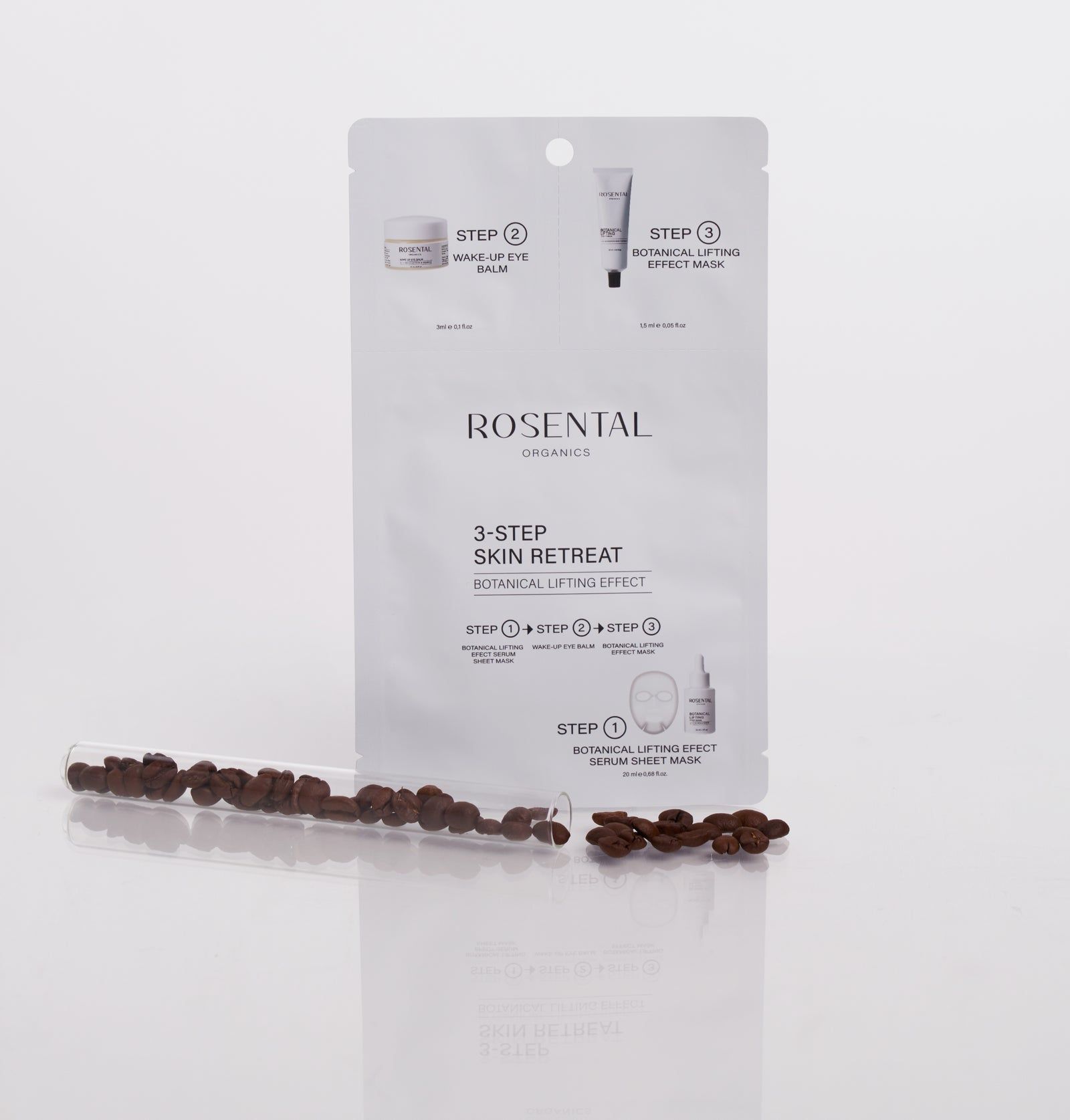 Weiße Verpackung mit Produktabbildungen und Text. "Rosental Organics 3-Step Skin Retreat" und Produktnamen sind sichtbar. Mit Kaffeebohnen.