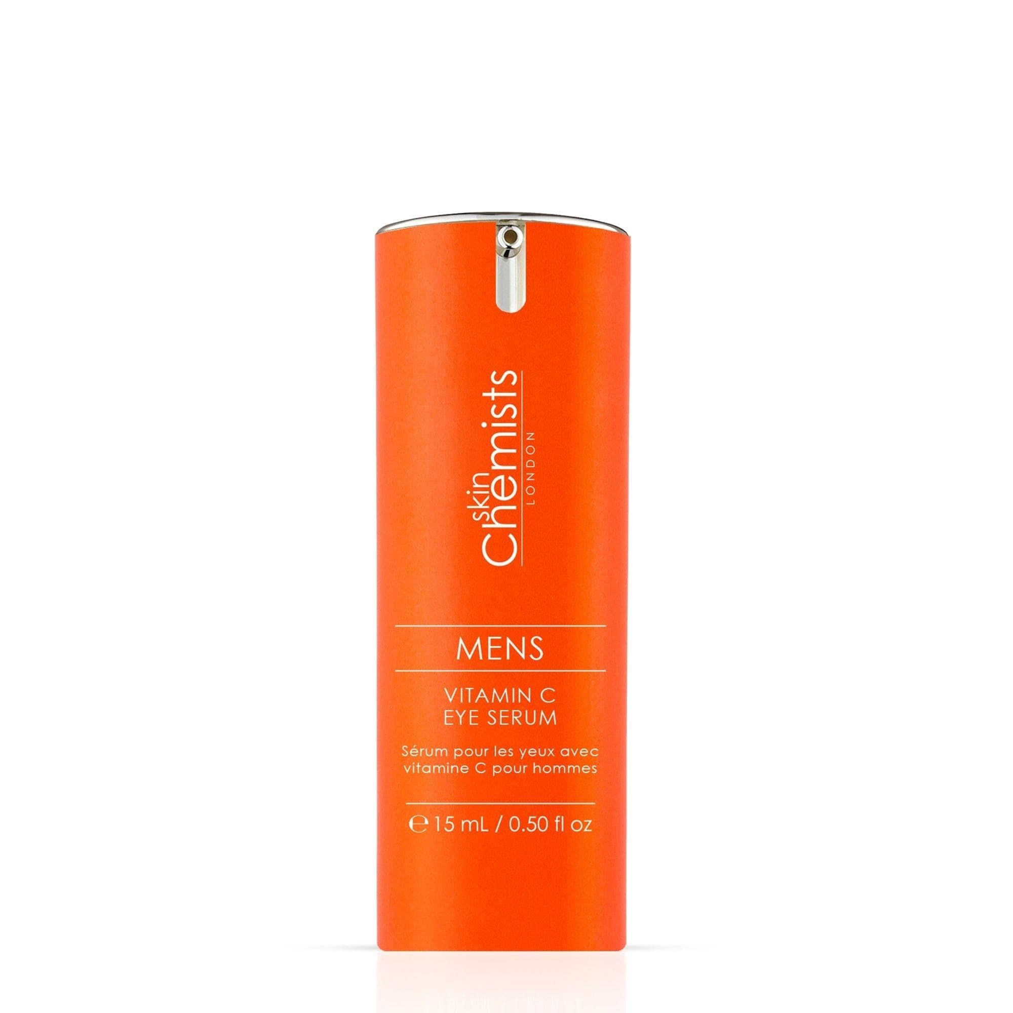 Orangefarbenes Serumfläschchen mit silberner Pumpe. Aufschrift: skinChemists LONDON, MENS Vitamin C EYE SERUM, 15 ml / 0.50 fl oz.