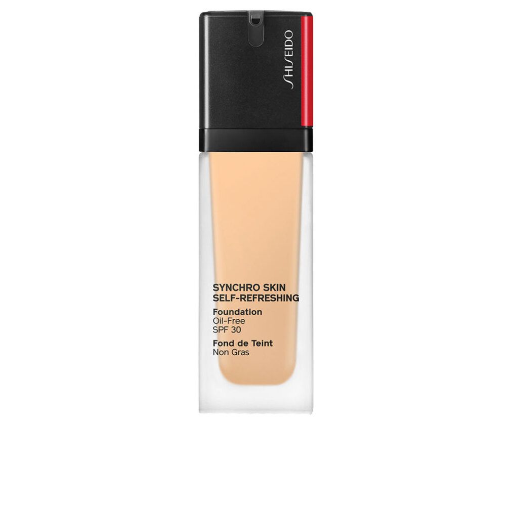 Foundation-Flakon. Schwarzer Deckel, roter Akzent. Text: Synchro Skin Self-Refreshing Foundation, Oil-Free, SPF 30, Fond de Teint Non Gras.