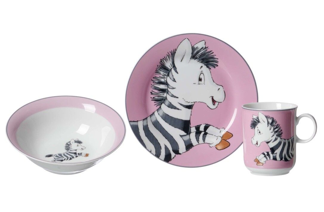 Kinderset mit Zebra-Motiv. Enthält Teller, Schüssel und Becher. Rosa und weiß. Zebra-Illustrationen auf allen Teilen.