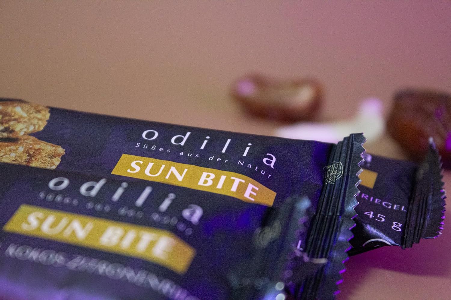 Odilia Sun Bite Riegel, 45g. Dunkle Verpackung mit gelbem Schriftzug.