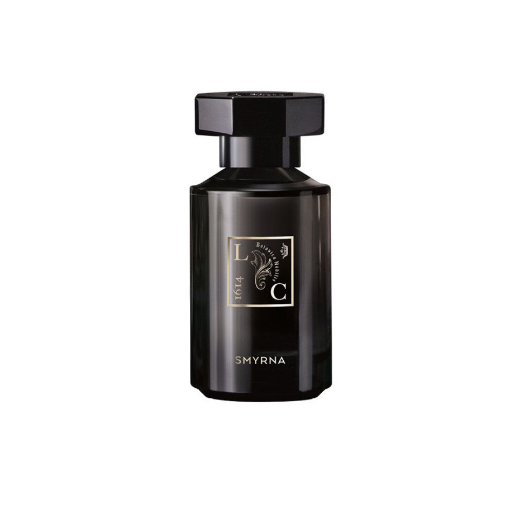 Schwarze Glasflasche mit schwarzem Deckel. Goldfarbenes Etikett mit Schriftzug "Smyrna".