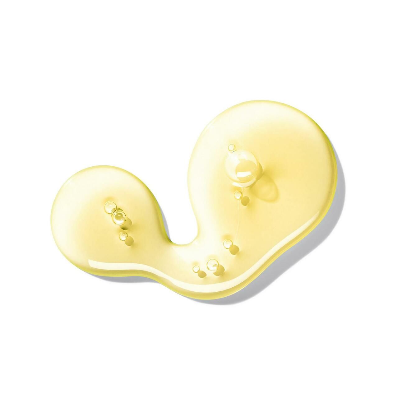 Gelbe Flüssigkeit mit Blasen. Schattenwurf.