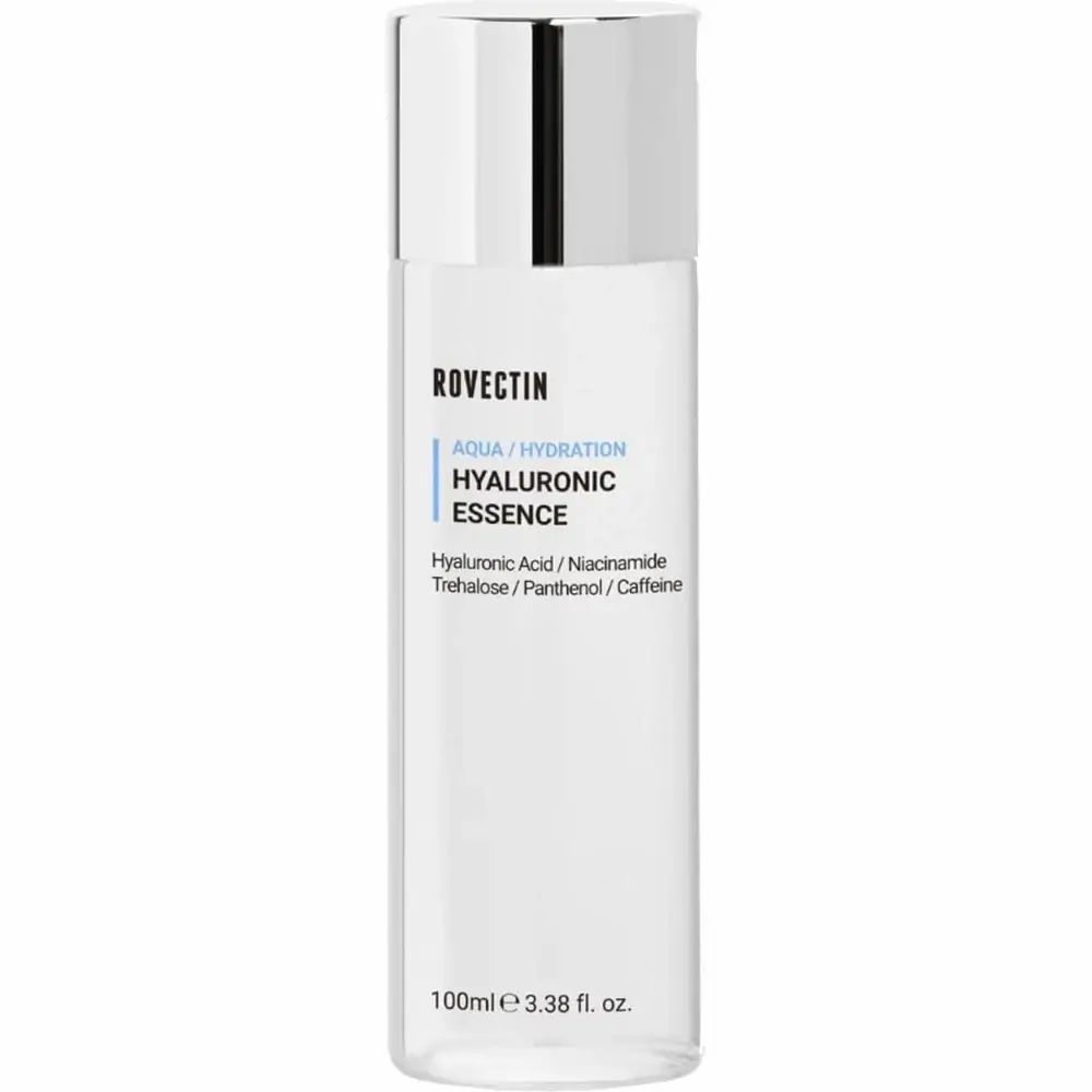Zylindrische Flasche mit silbernem Deckel. Aufschrift: ROVECTIN, AQUA / HYDRATION, HYALURONIC ESSENCE. Enthält Hyaluronsäure, Niacinamid, Trehalose, Panthenol, Koffein.