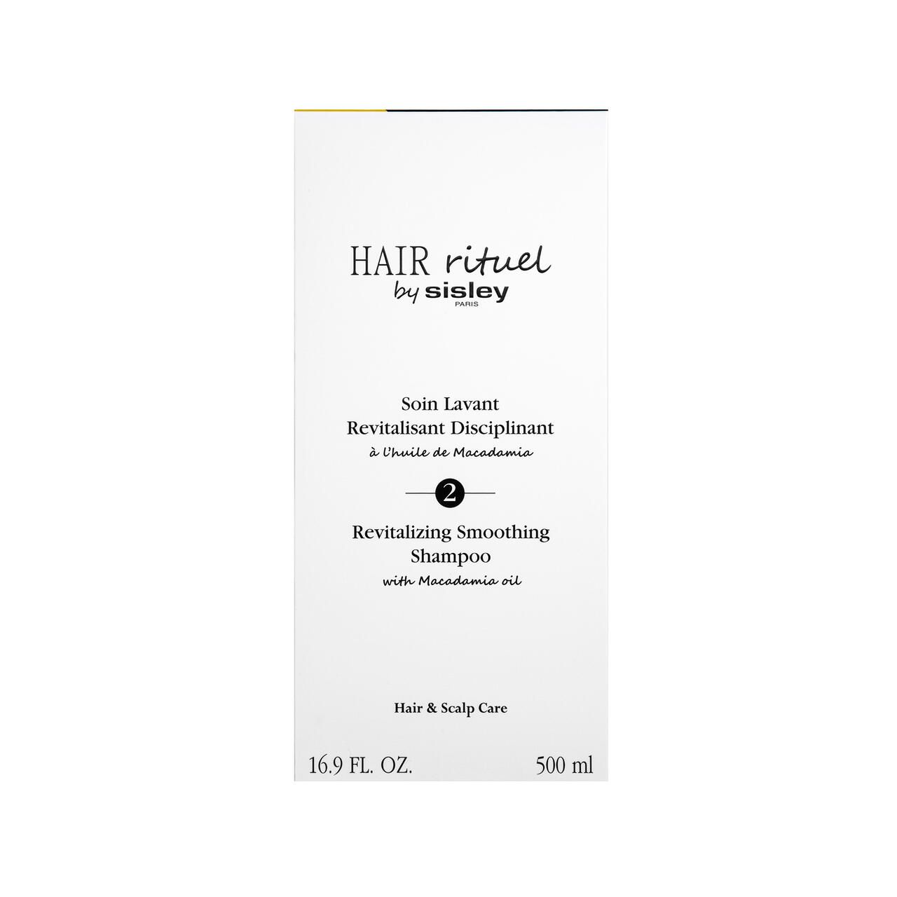 Weiße Verpackung mit Produktbezeichnung und Marke: Hair Rituel by Sisley. Revitalisierendes Shampoo. 16.9 FL. OZ. und 500 ml.