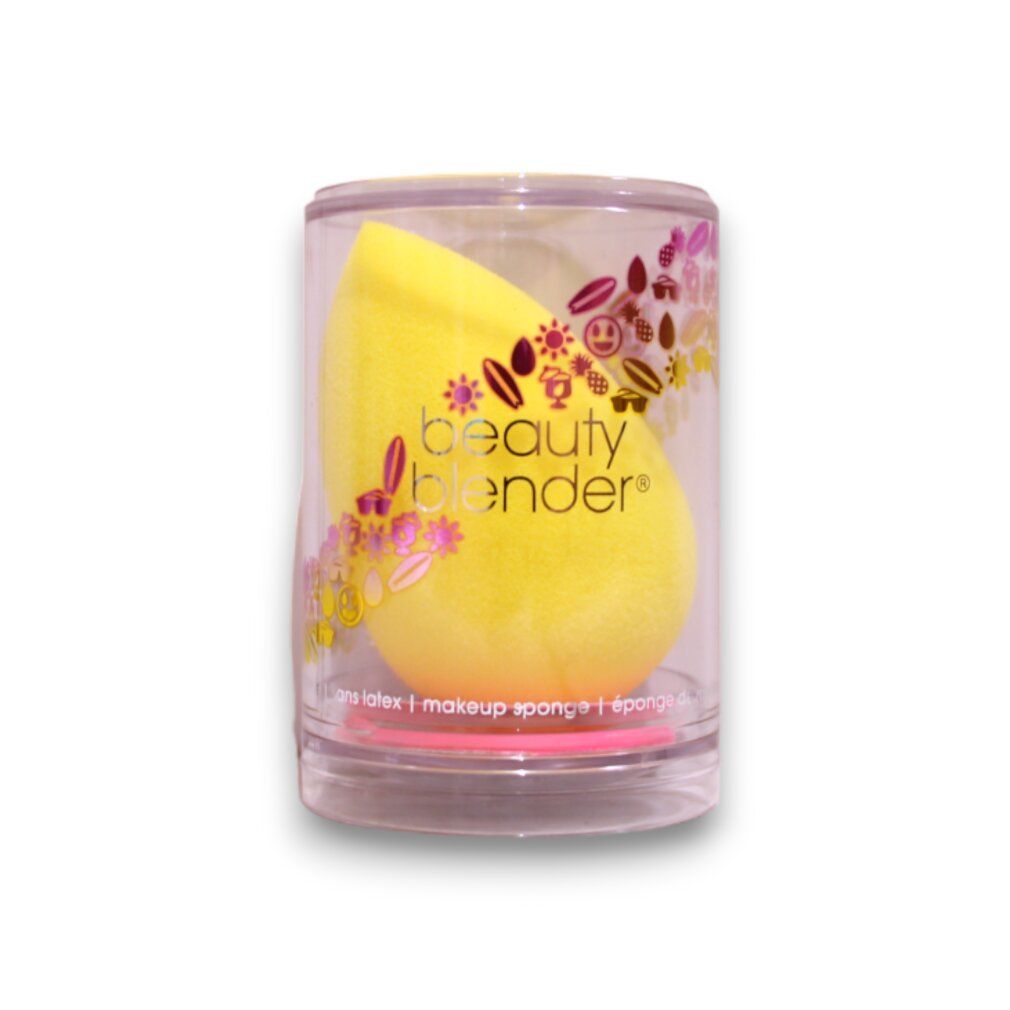 Gelber beautyblender Joy in transparenter Hülle. Aufgedruckter Schriftzug und florales Muster. Ei-Form.