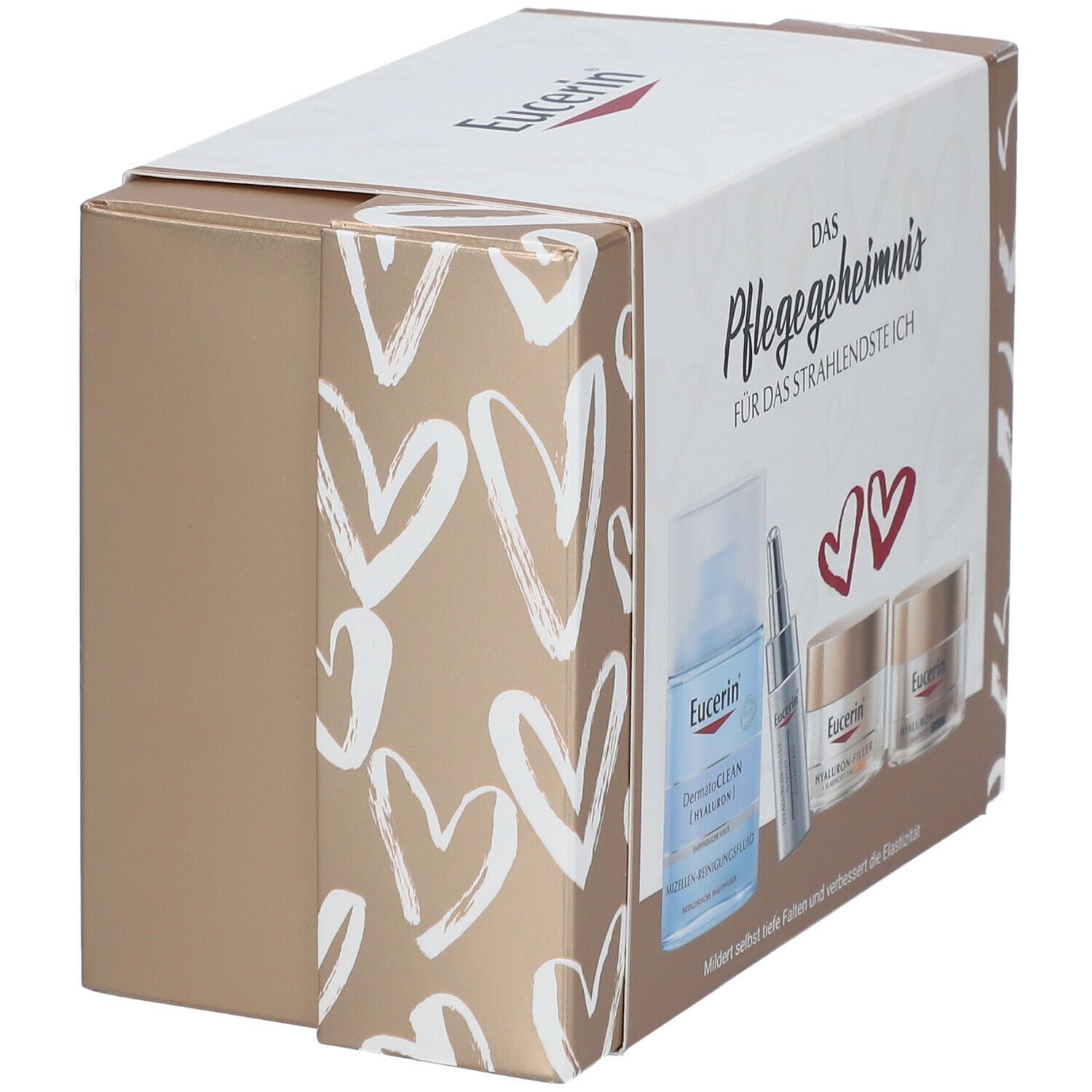 Geschenkset mit Produkten. Box mit goldfarbenen Seiten und weißer Front mit Herzmuster. Enthält Flasche, Serum und Cremes. Eucerin-Logo.