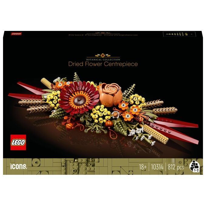 LEGO Icons 10314 Centrotavola di Fiori Secchi. La confezione mostra una composizione di fiori LEGO rossi, gialli e marroni. Il set contiene 812 pezzi ed è destinato a persone dai 18 anni in su. Il logo LEGO e la scritta "Botanical Collection" sono ben visibili.