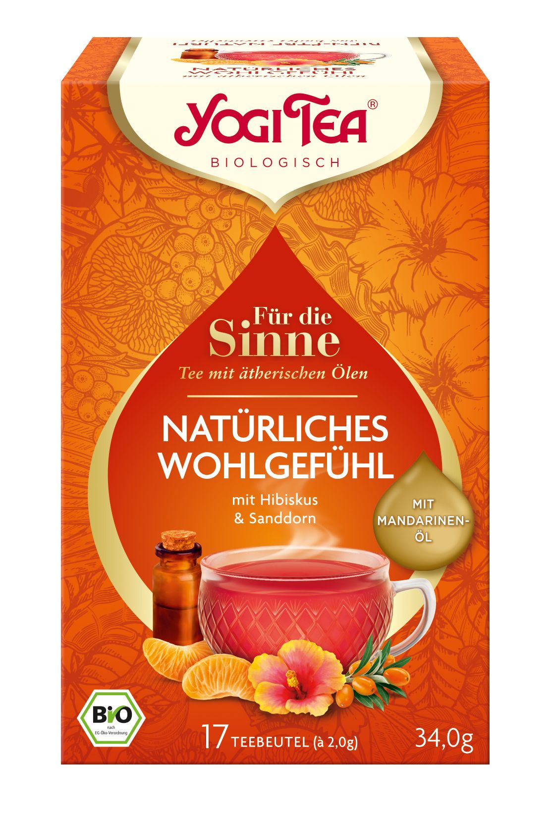 Yogi Tea-Verpackung. Orangefarben mit Produktabbildung. Enthält 17 Teebeutel. Aufschrift: Natürliches Wohlgefühl, Tee mit ätherischen Ölen.