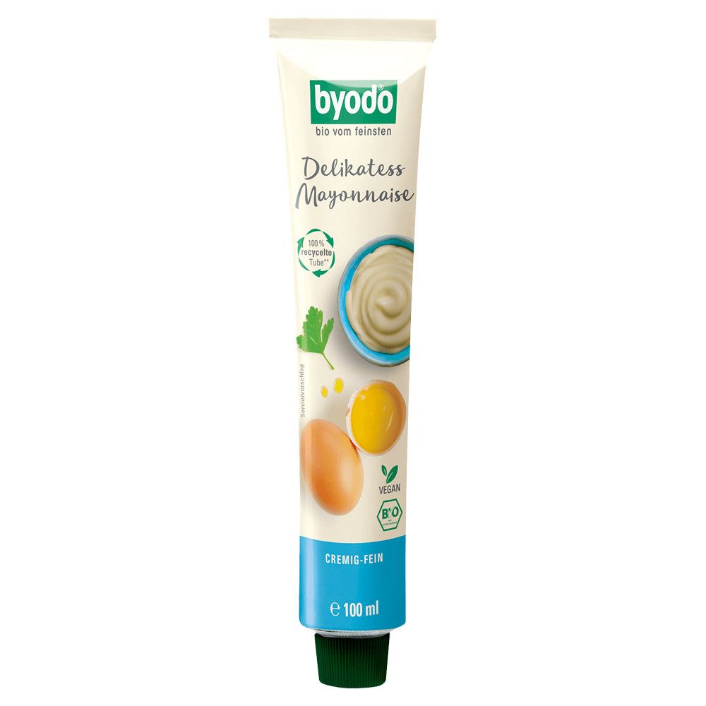 Tube mit BYODO Delikatess Mayonnaise. Grün-weißes Design, Produktabbildungen, Text: "Delikatess Mayonnaise", "vegan", "100 ml".