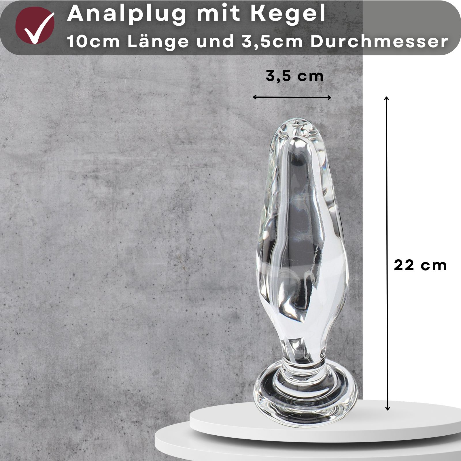Analplug mit Kegel. 10cm lang, 3,5cm Durchmesser. Transparentes Material. Auf weißer Oberfläche. Maße.