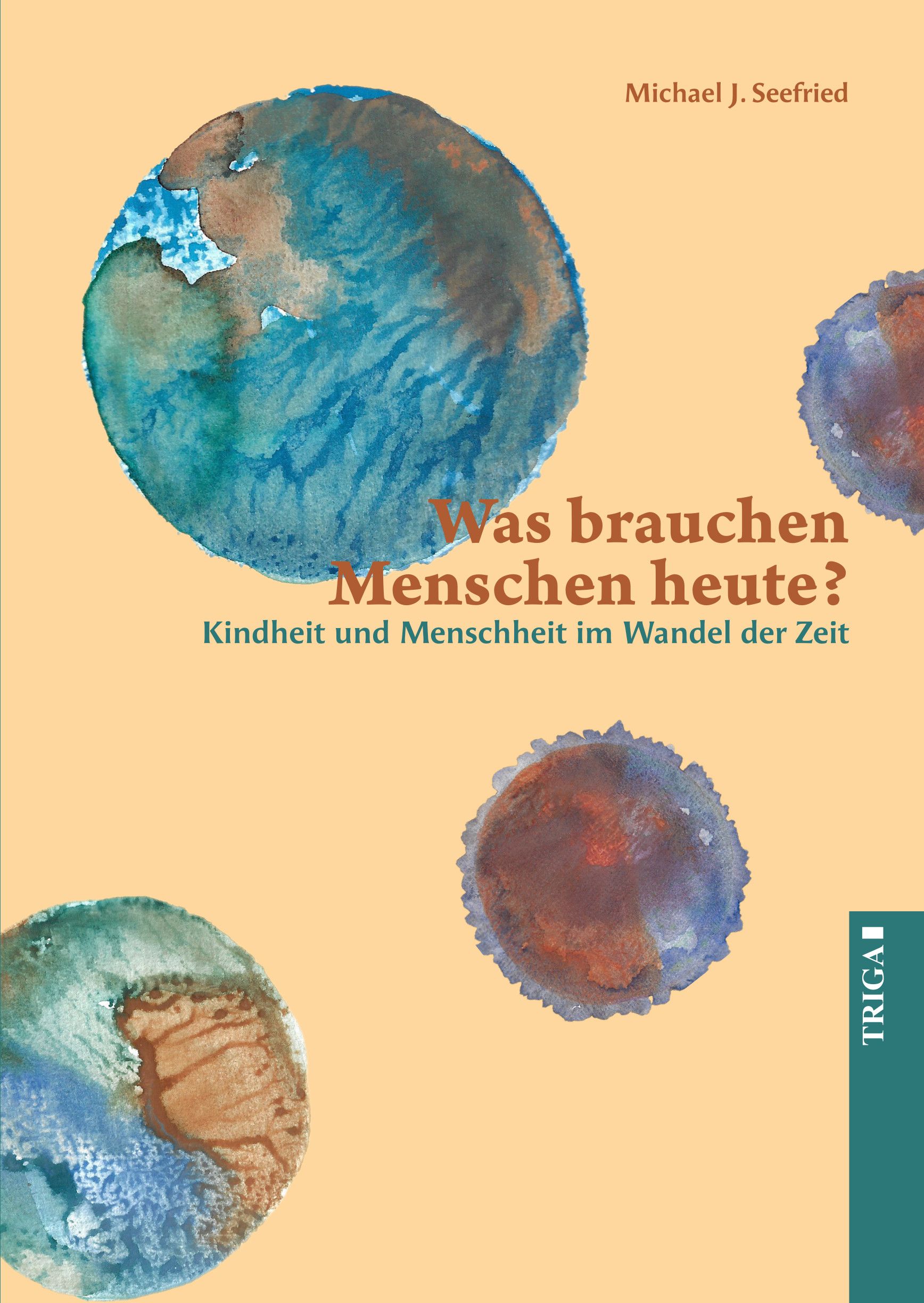 Buchcover mit Titel: Was brauchen Menschen heute? Autor: Michael J. Seefried. Illustrationen von Erdkugeln in Aquarelltechnik.