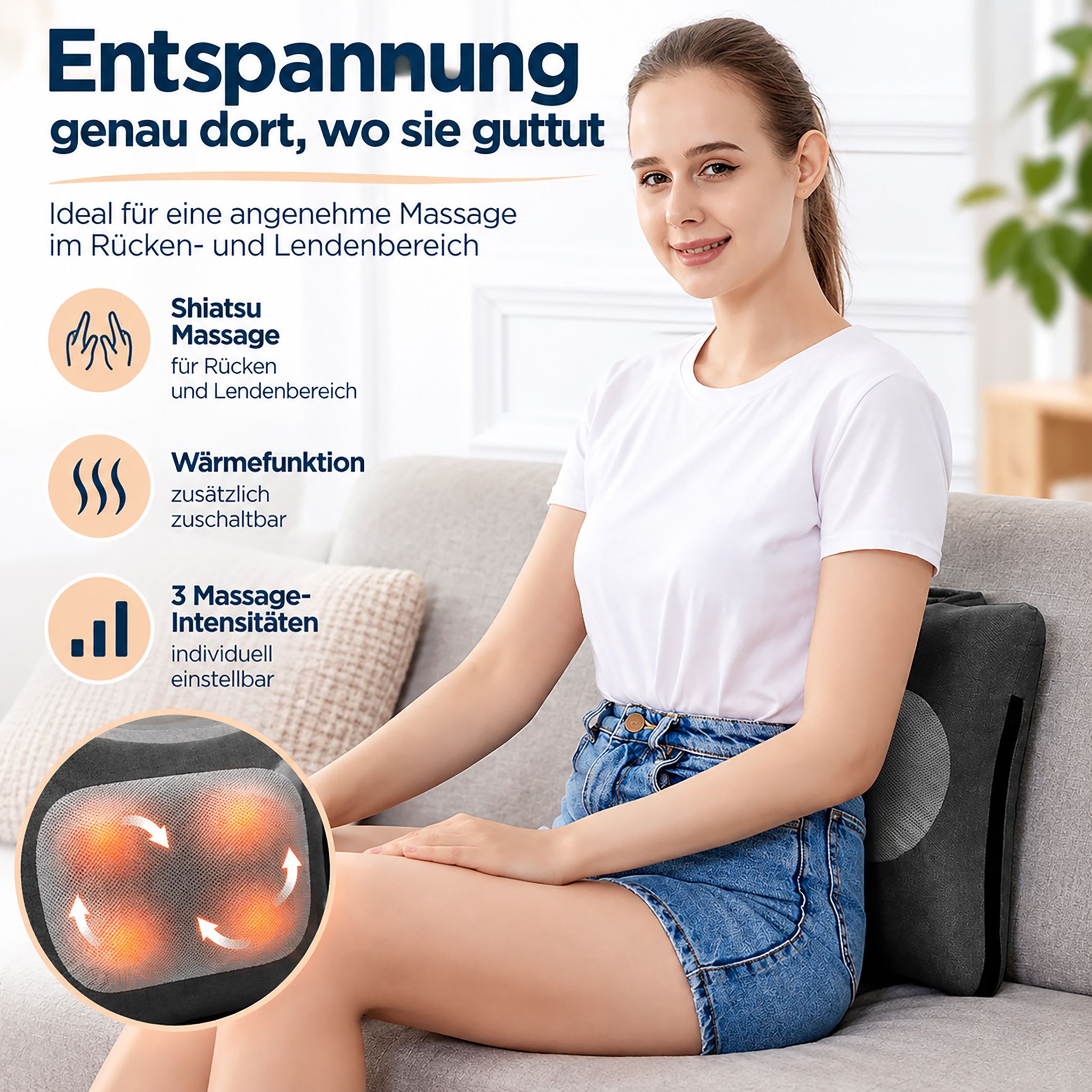Ein graues Massagekissen mit vier leuchtenden roten Massageknoten, auf einem Sessel liegend.