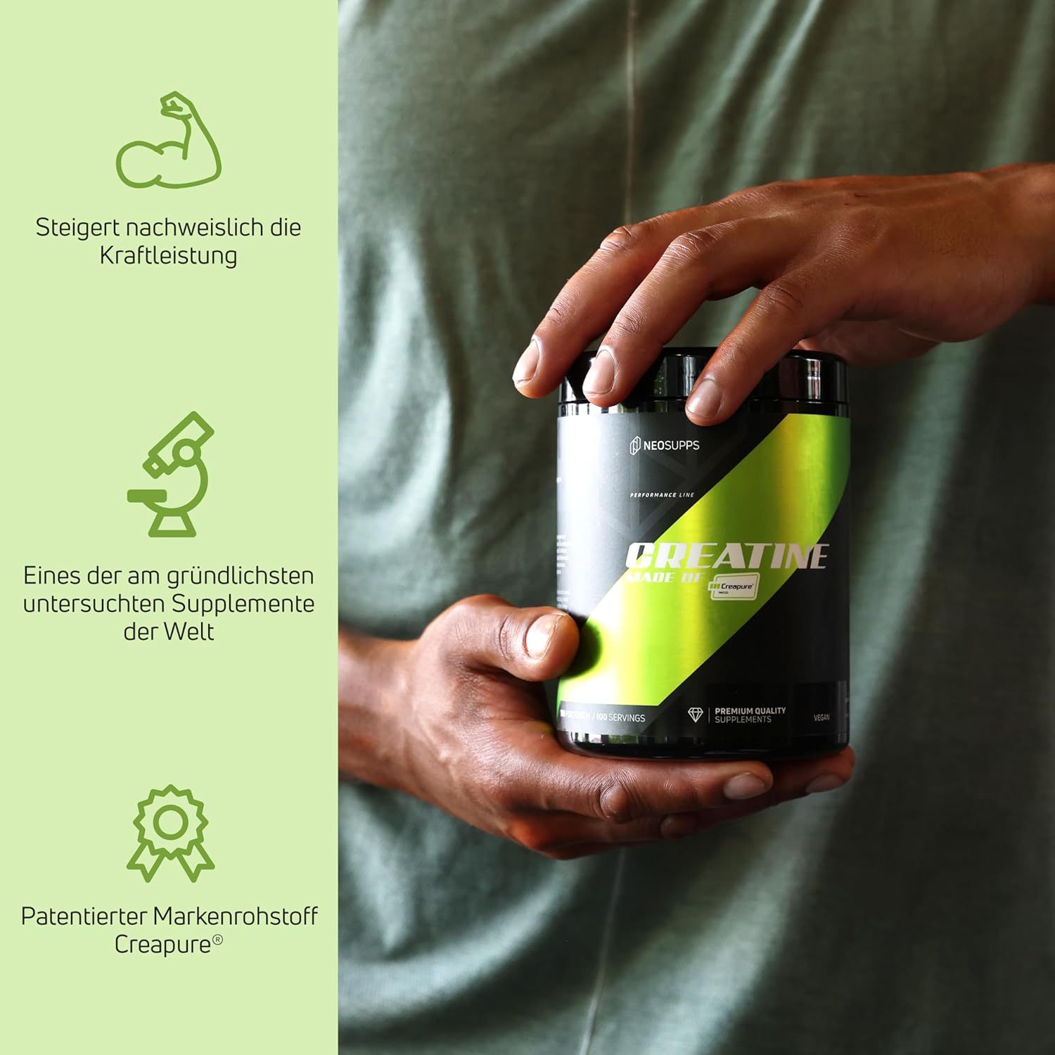Schwarze Dose mit grünem Streifen. Aufschrift: Creatine Made of Creapure®. Hände halten die Dose. Text: Steigert Kraftleistung.