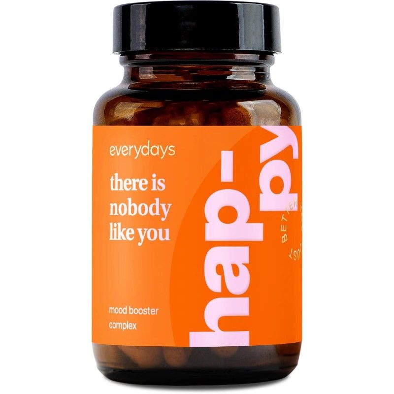 Braune Glasflasche mit orangefarbenem Etikett. Aufschrift: happy, there is nobody like you. Kapseln sichtbar.