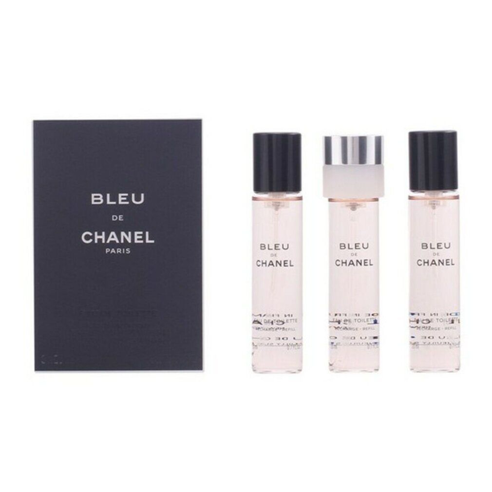 Drei kleine Parfümflakons und eine schwarze Box von Bleu de Chanel Paris.