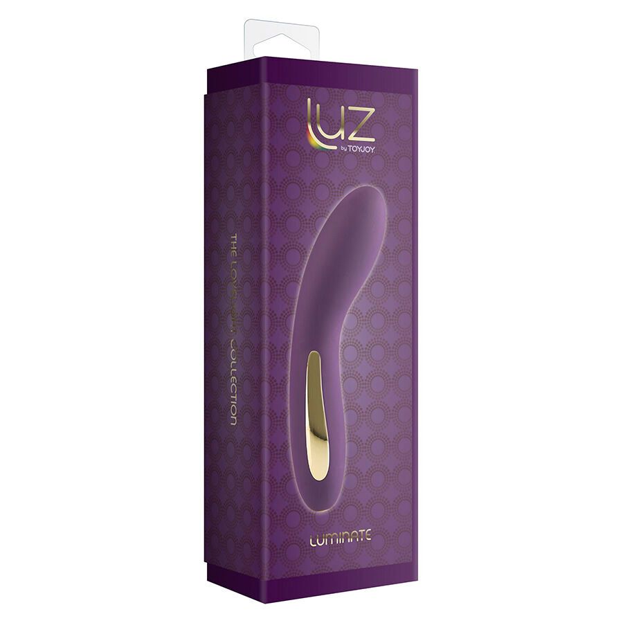 Verpackung für einen Vibrator. Lila Schachtel mit Produktabbildung und goldfarbenem Akzent. Aufschrift: LUZ by TOYJOY, LUMINATE.