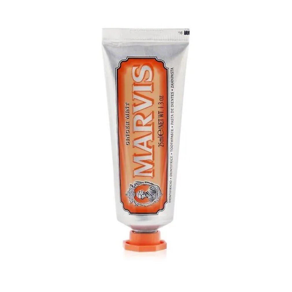 Zahnpasta-Tube. Silberfarben, orangefarbene Akzente. Aufschrift: MARVIS Ginger Mint. 25ml/1.3 oz.