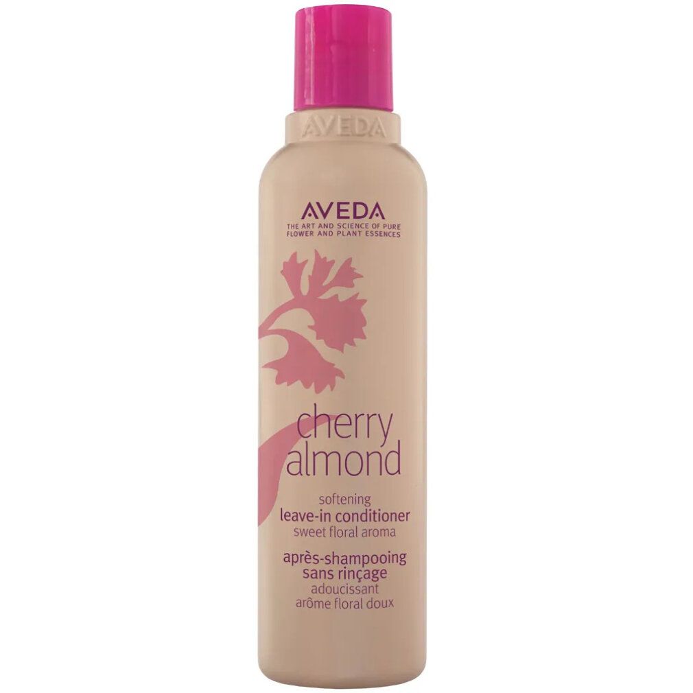 Beige Flasche mit pinkfarbenem Deckel. Aufschrift: Aveda, Cherry Almond, Leave-in Conditioner. Floral-Design.