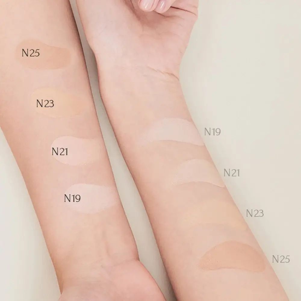 Arme mit verschiedenen Farbtönen des Make-ups. Farbnummern: N19, N21, N23, N25.