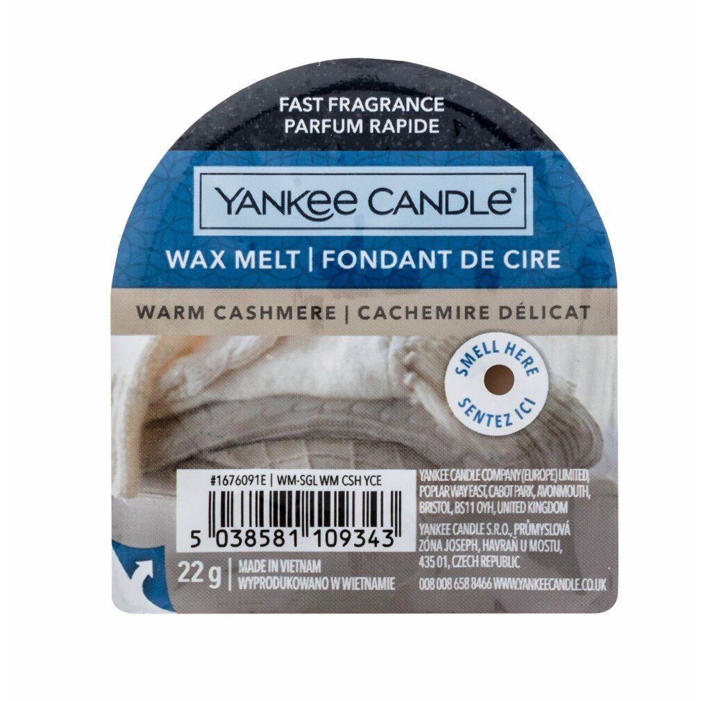 Verpackung mit Duftwachs. Text: Yankee Candle, Warm Cashmere, 22g. Aufdruck mit Barcode und weiteren Informationen.