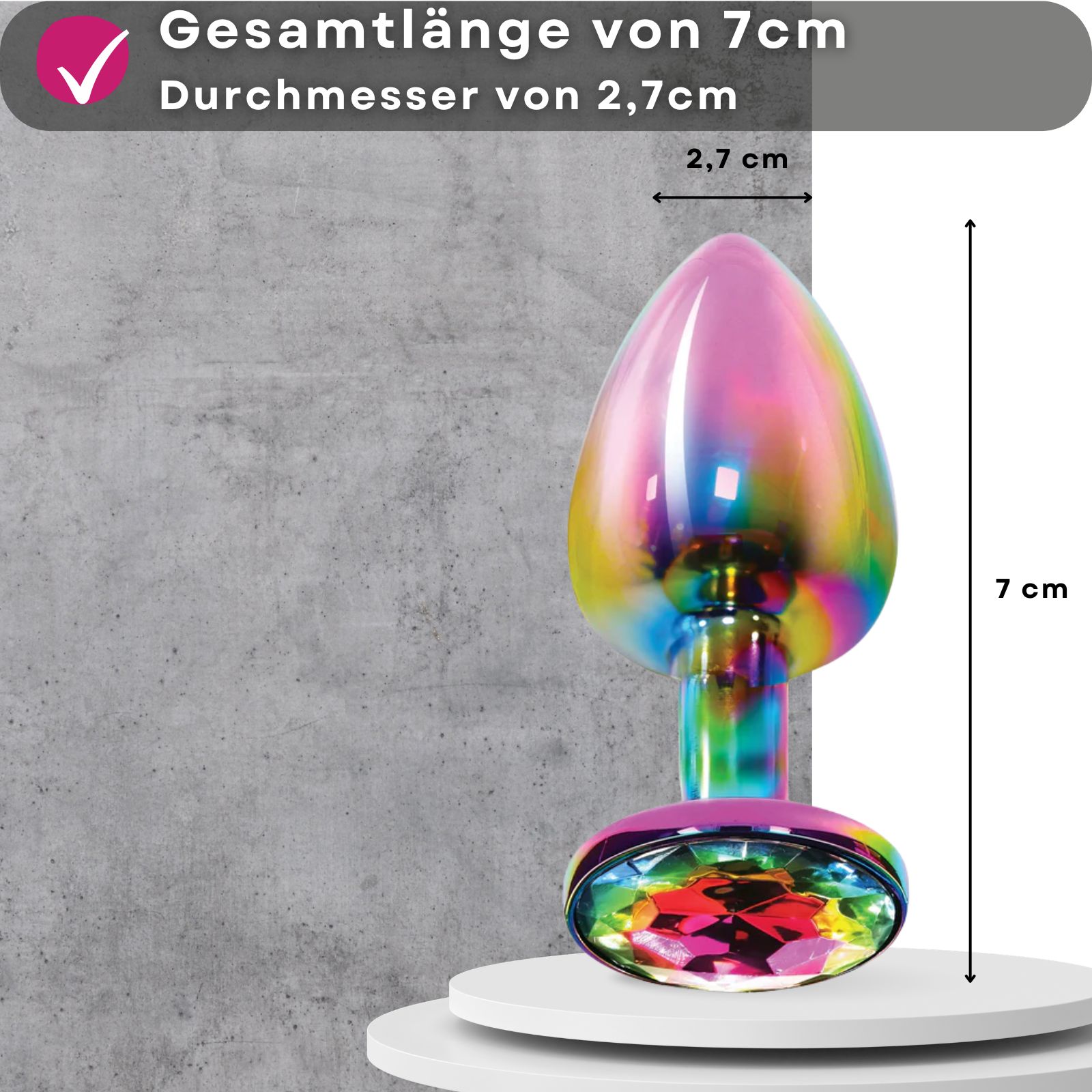 Analplug, multicolor, Metall, Zierstein. 7cm lang, 2,7cm Durchmesser. Auf Podest.