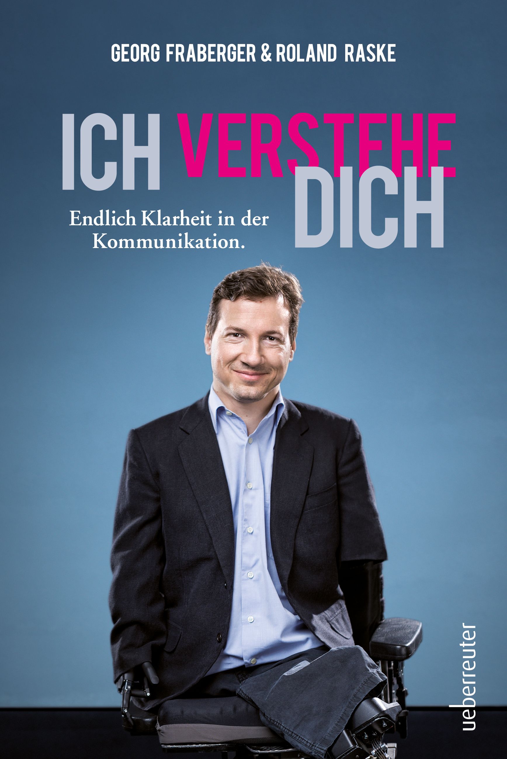 Buchcover mit Titel "Ich verstehe dich". Autoren: Georg Fraberger & Roland Raske. Mann im Anzug vor blauem Hintergrund.