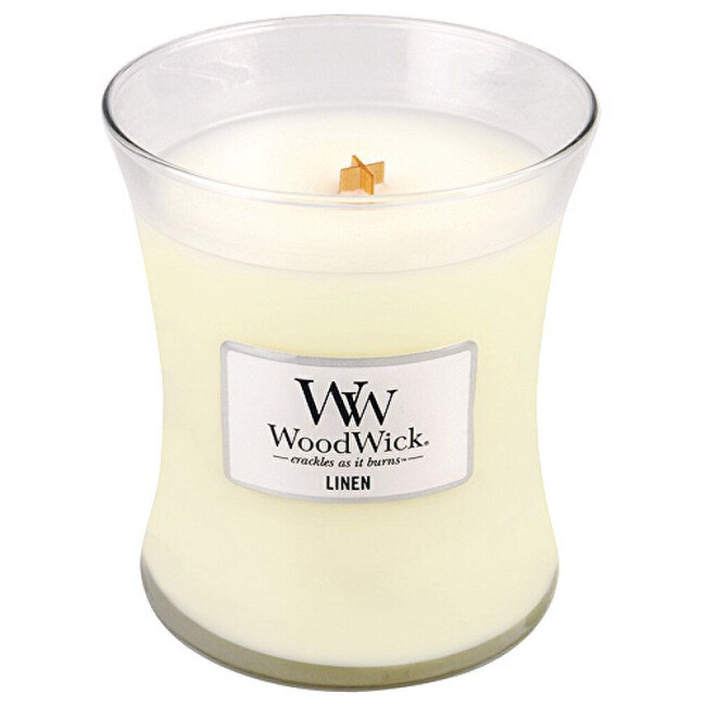 Sanduhrförmige Kerze mit Holzdocht. Auf dem Etikett steht "WoodWick Linen".