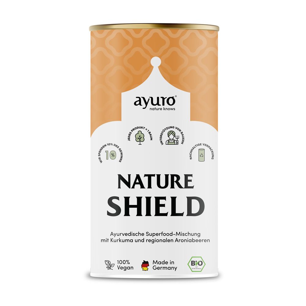 Zylindrische Dose mit Aufschrift "ayuro Nature Shield". Bio-Siegel, vegan, Made in Germany. Orangefarbenes Muster.
