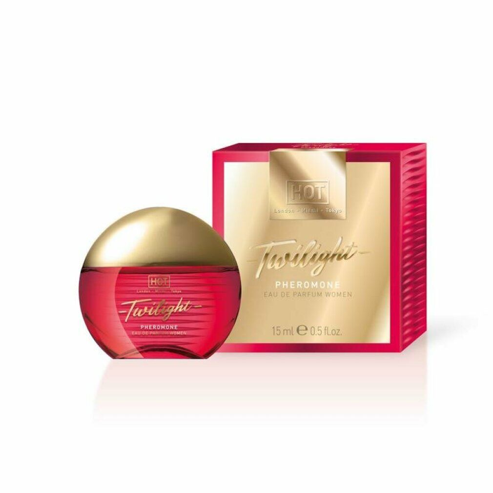 Parfumflakon und Verpackung. Roter Flakon, goldene Kappe, rote Verpackung.