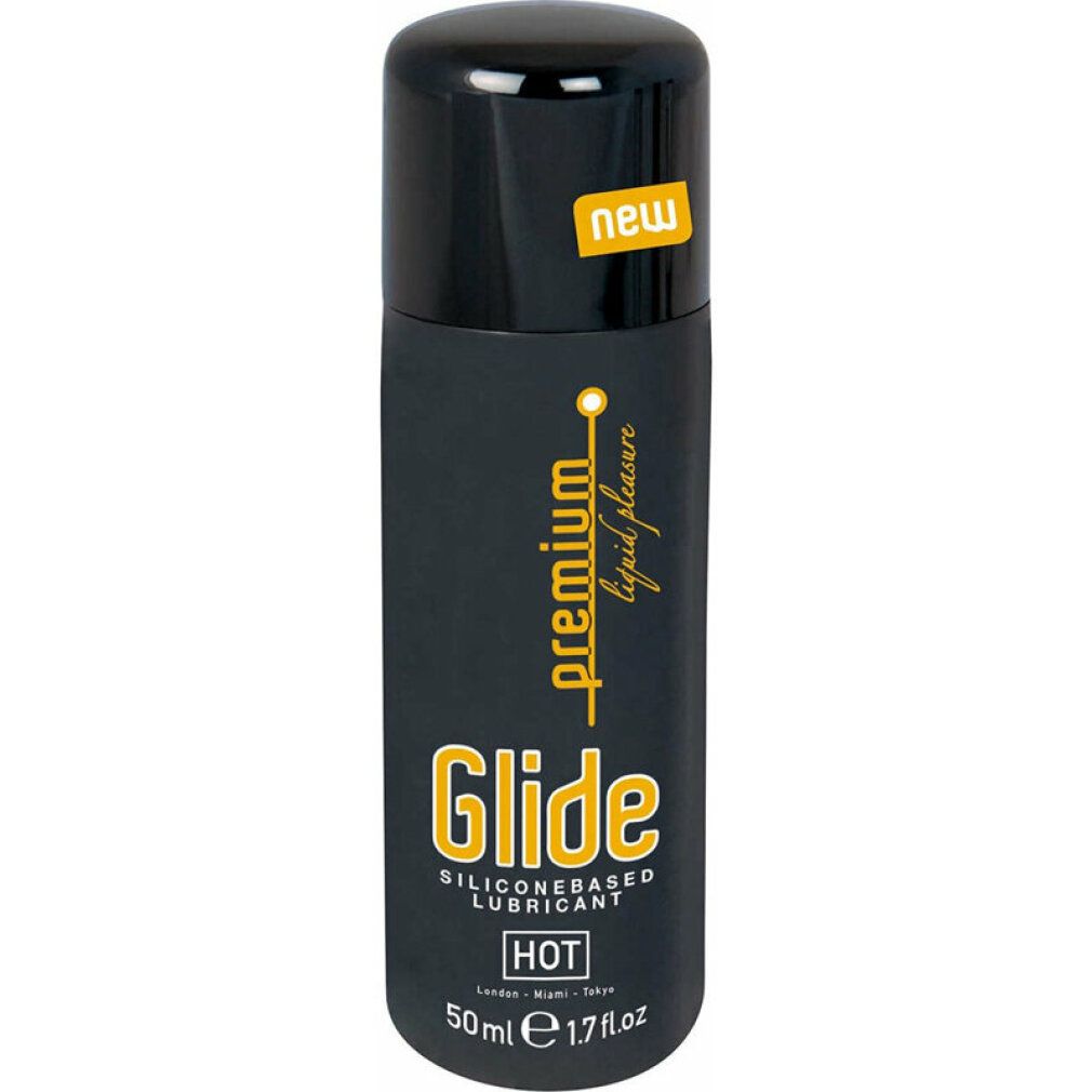 Schwarze Flasche mit gelbem Etikett. Aufschrift 'Glide'. 'New' Aufkleber. 'Hot' Text.