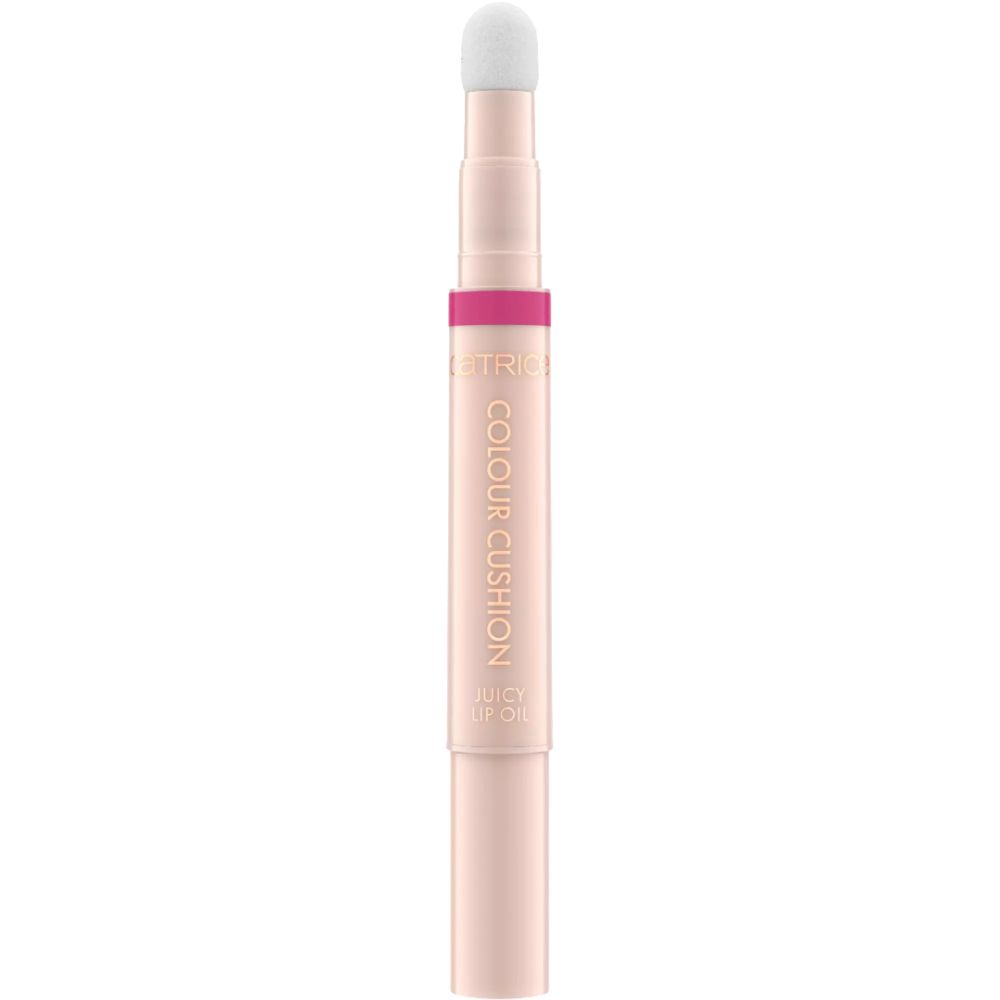 Ein rosafarbener Lippenstift-Applikator mit weißer Spitze und der Aufschrift 'COLOUR CUSHION JUICY LIP OIL'.