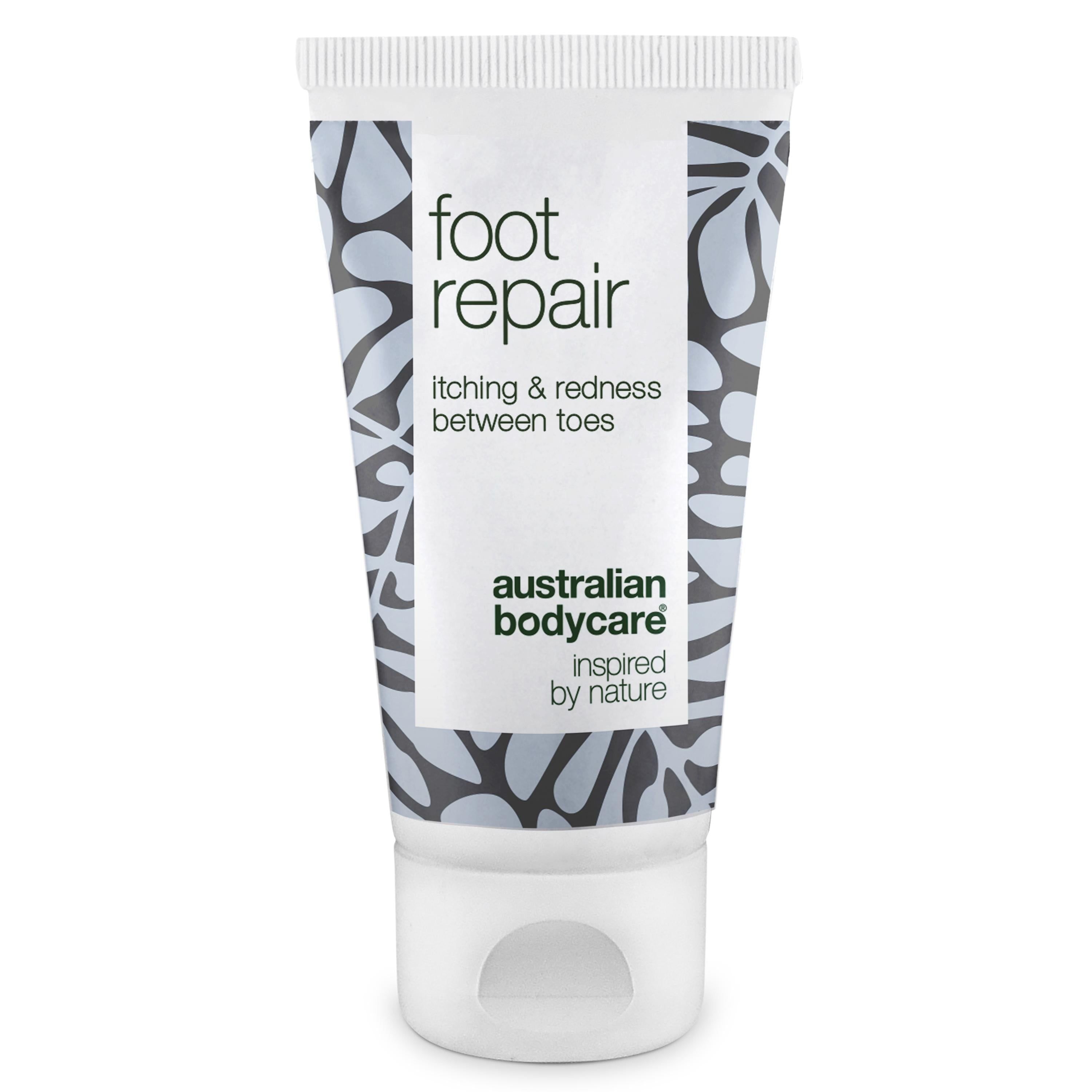 Fußpflege-Tube. Weiß, mit floralem Muster und Text: foot repair, itching & redness between toes, Australian Bodycare.