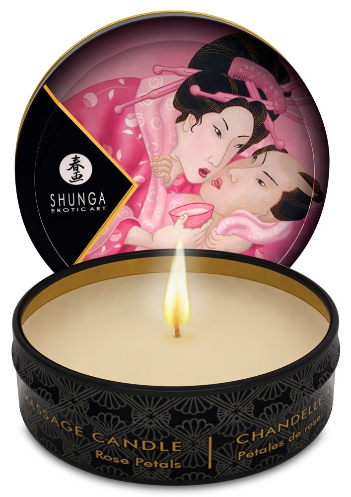 Brennende Massagekerze in schwarzer Dose mit Deckel, der asiatische Kunst zeigt.