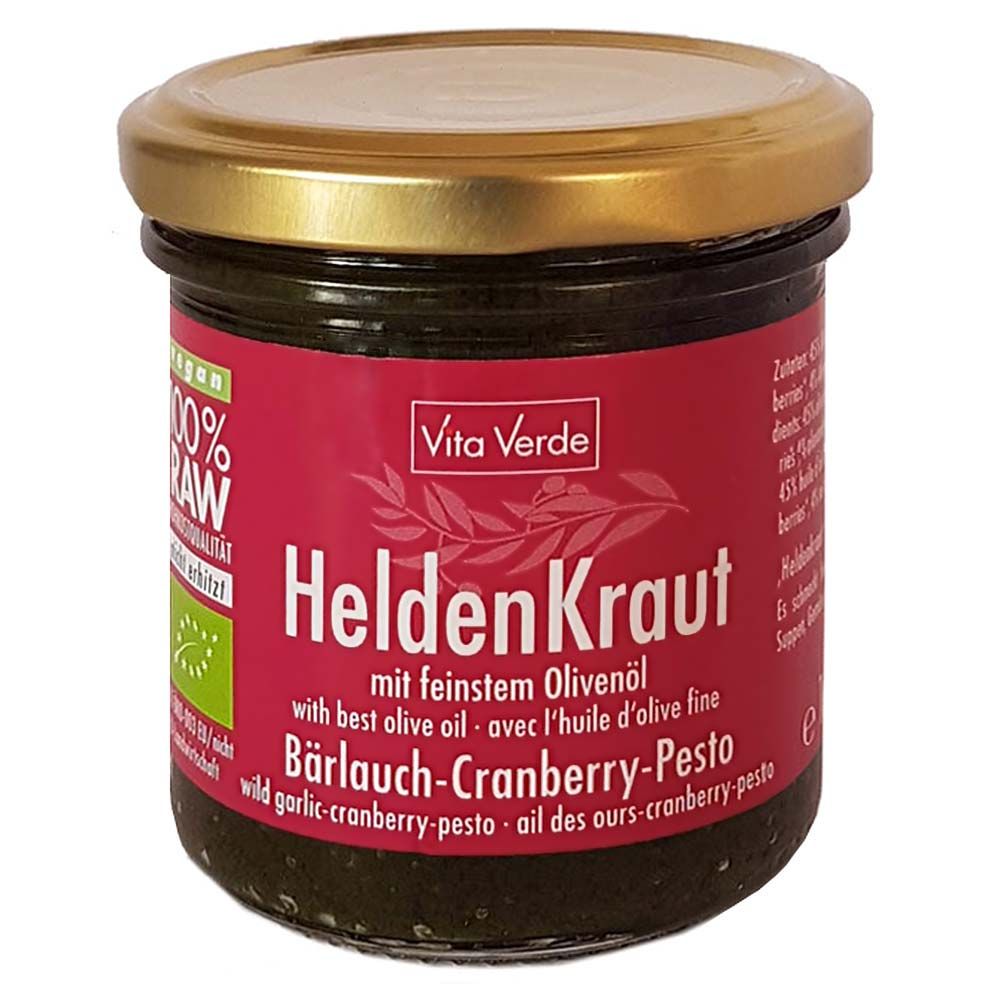 Glas mit Vita Verde HeldenKraut Bärlauch-Cranberry-Pesto. Roter Aufkleber mit Produktnamen und Logo. Goldfarbener Deckel.