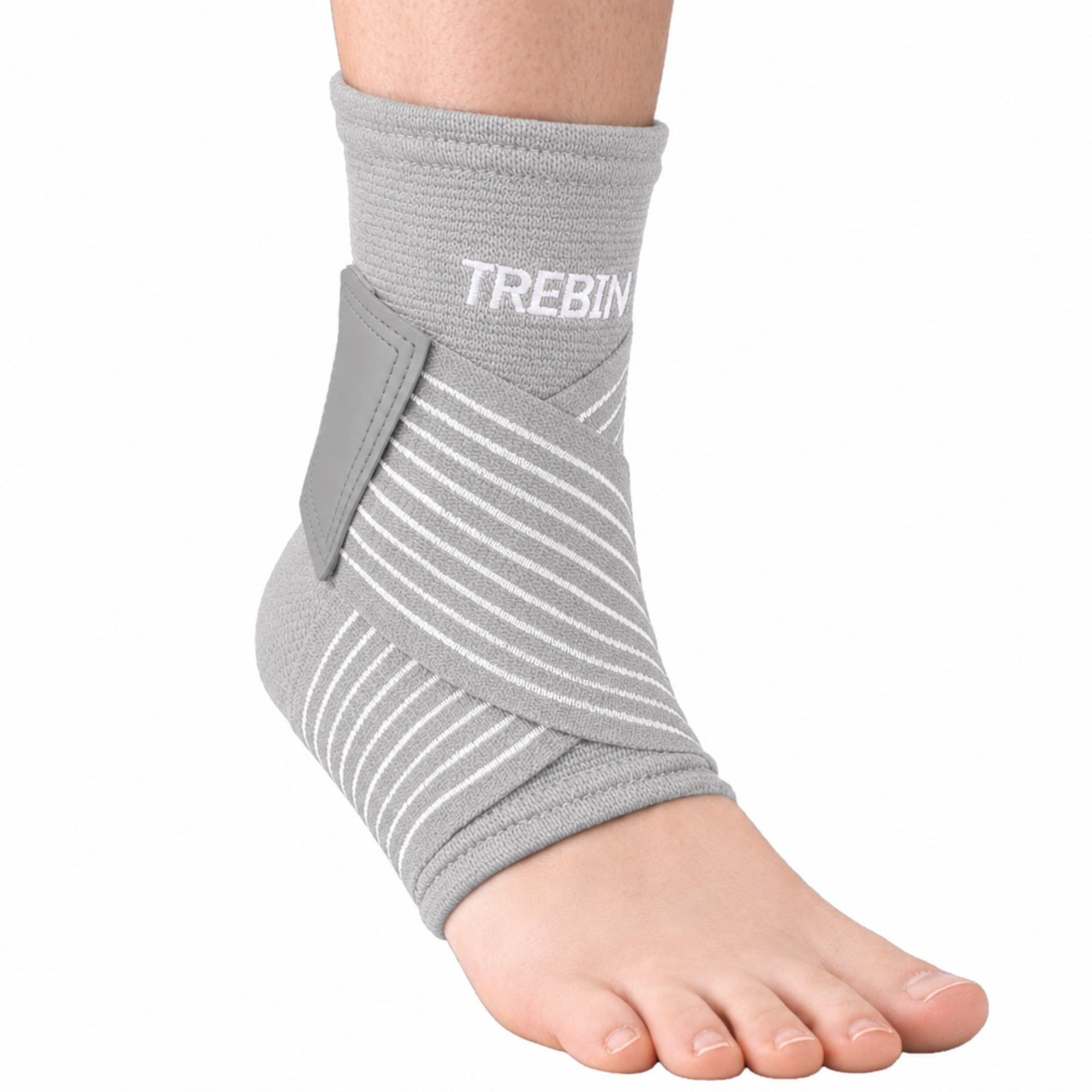 Grauer Knöchelbandage mit weißen Streifen und Klettverschluss. Marke: TREBIN.